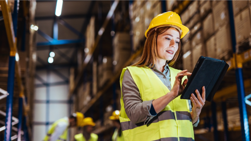 Blog banner showing an employee using a tablet to improve operational processes